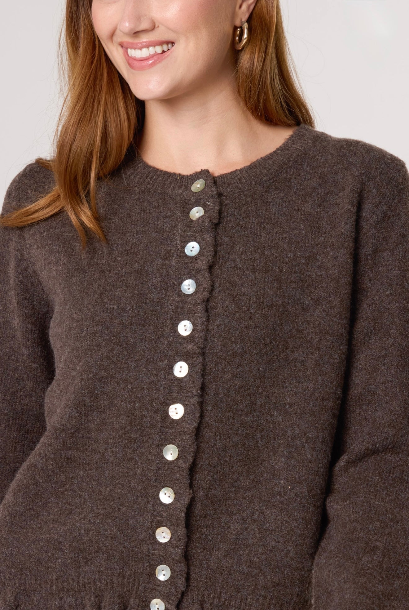 Women’s coffee knit cardigan with ruffle trim and button front