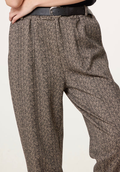 Side view of Londra camel herringbone trousers — chic tapered silhouette.